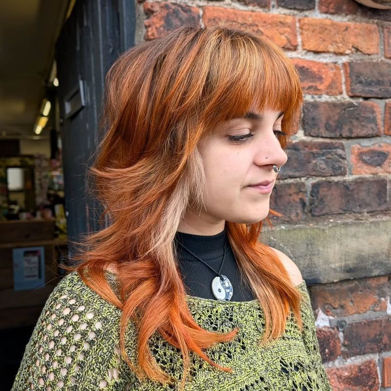 46. Copper Shag with Face-Framing Blonde Money Pieces