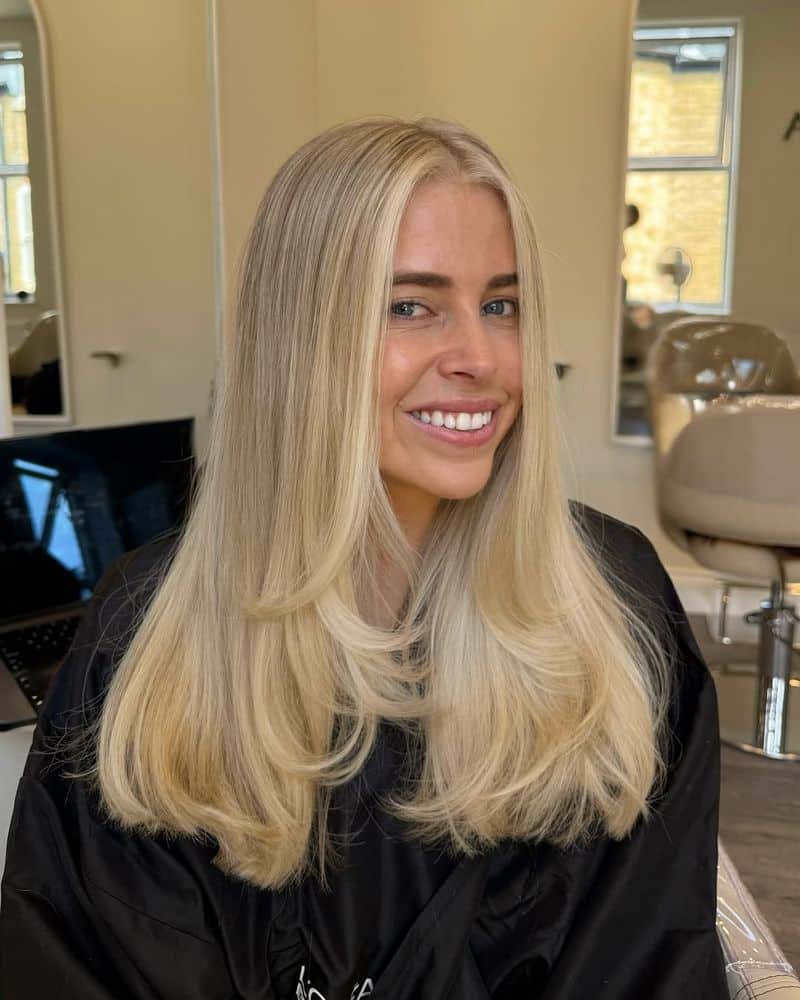 29. Creamy Blonde Blowout with Soft Face-Framing Layers