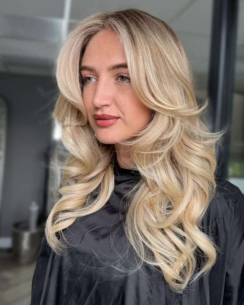 35. Creamy Layered Blowout with Butterfly Bangs