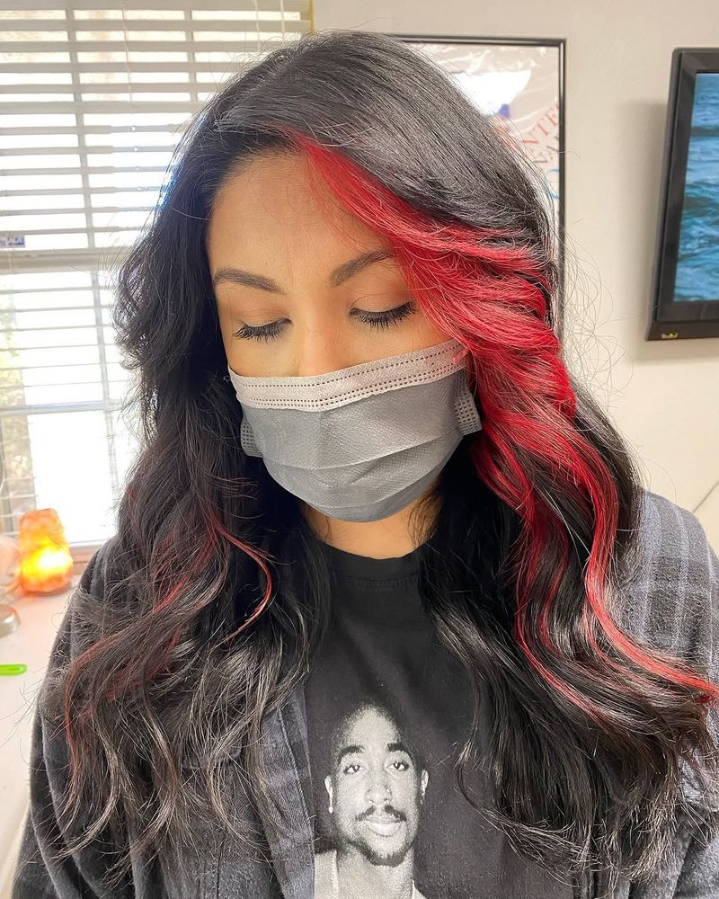 11. Crimson Side-Swept Bangs