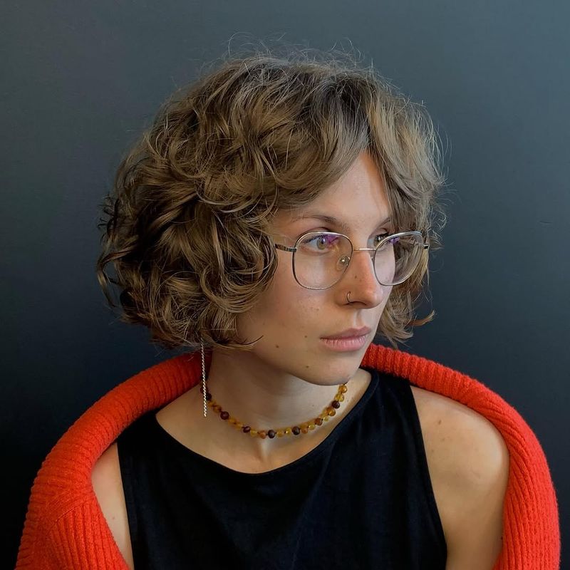 16. Curly Bob with Curtain Bangs