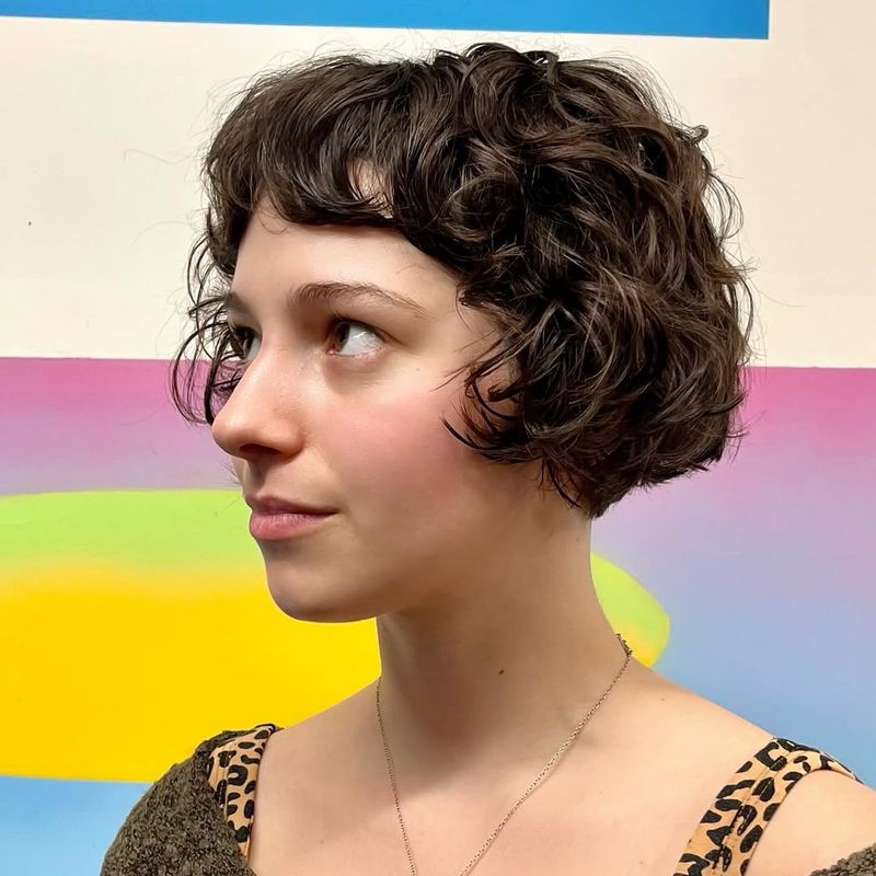 36. Curly Cropped French Bob with Baby Bangs