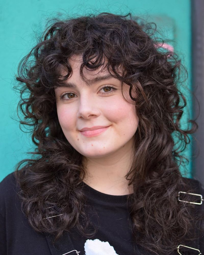 37. Curly Dark Brown Wolf Cut