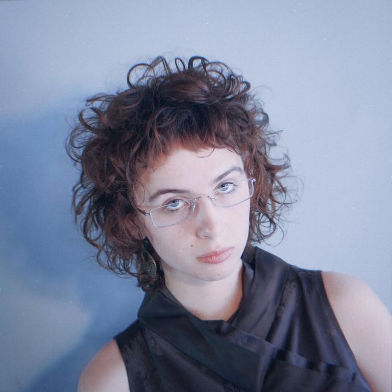 48. Curly Shag with Micro Bangs