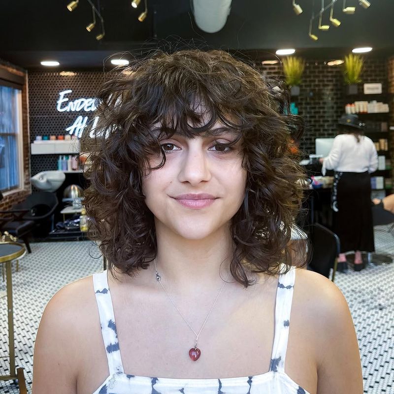 49. Curly Shag with Piecey Fringe