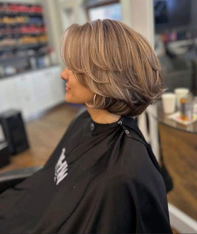 44. Curved Stacked Bob with Side-Swept Layers