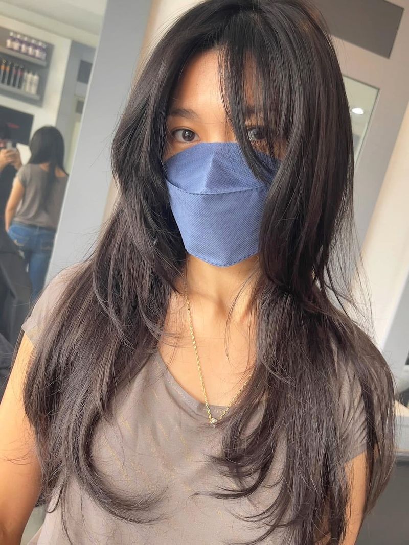 17. Dark Brown Feathered Layers with Wispy Bangs