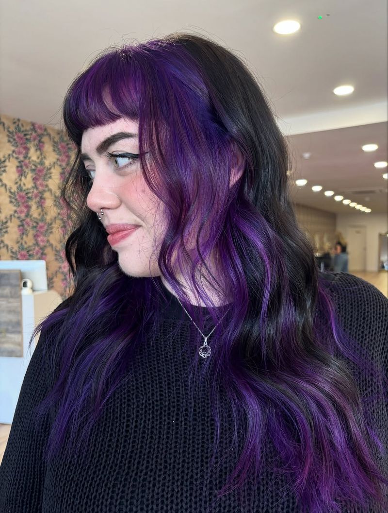 25. Dark Brunette with Electric Purple Peekaboo Highlights