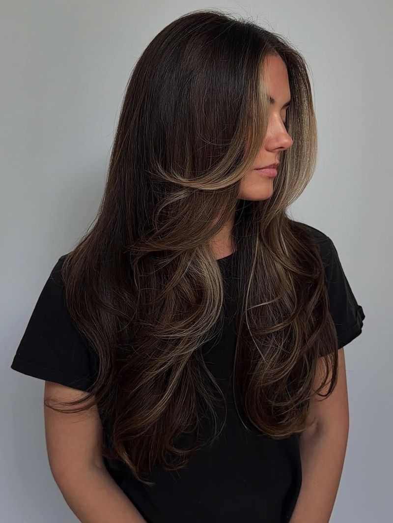 42. Dark Chocolate Blowout with Face-Framing Honey Highlights