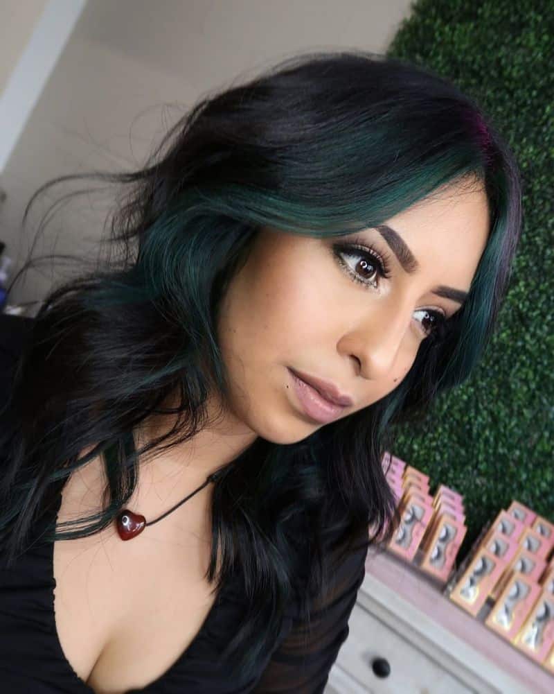 4. Dark Hair with Emerald Face Framing Highlights