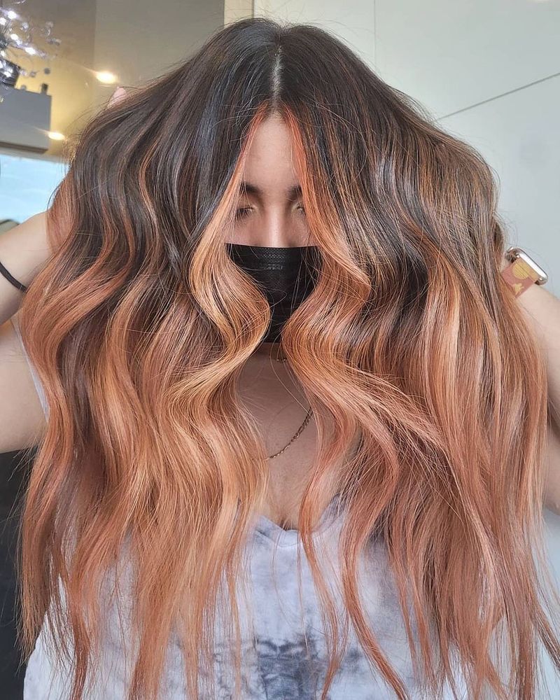 30. Dark Roots with Peach Money Pieces