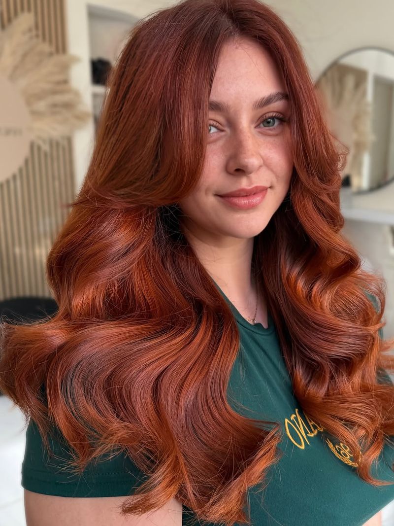 5. Deep Auburn Waves with Curtain Bangs