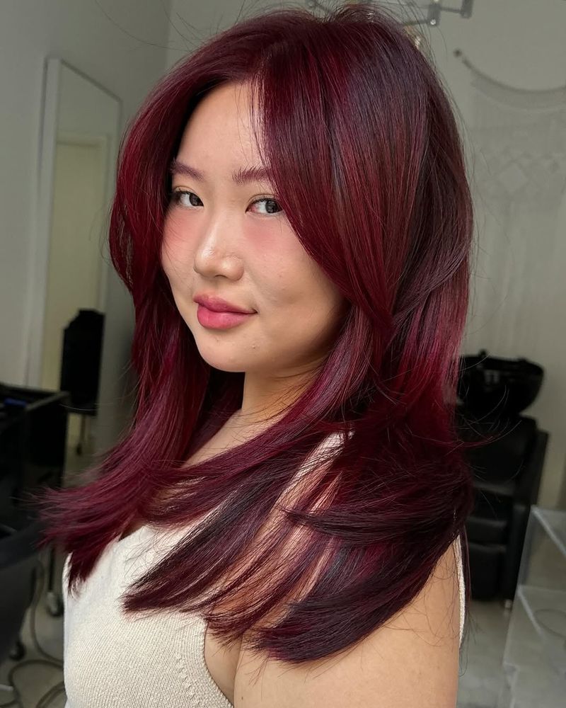 48. Deep Berry Layers with Curtain Bangs