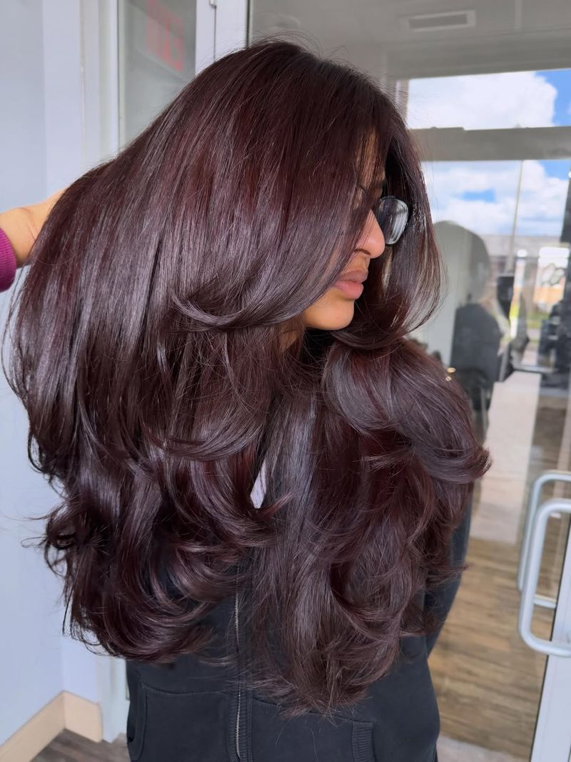 14. Deep Berry Layers with Curtained Bangs