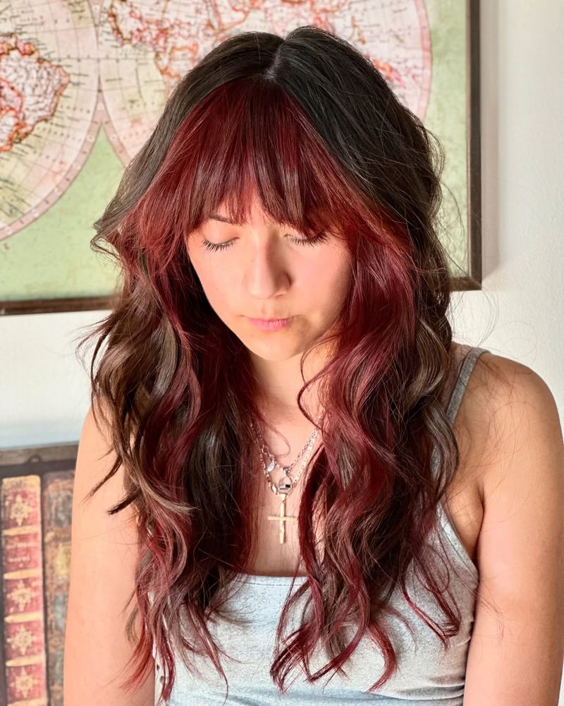 12. Deep Brunette and Burgundy Halo Bangs