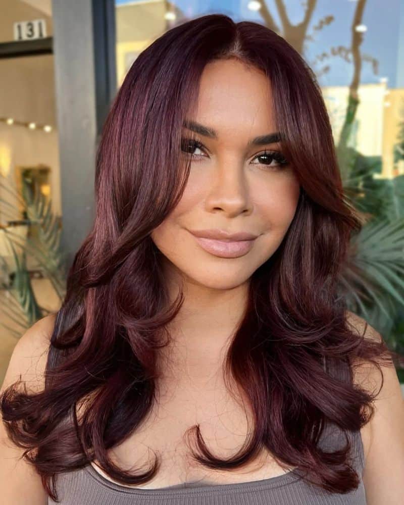 10. Deep Burgundy Blowout with Curtain Bangs