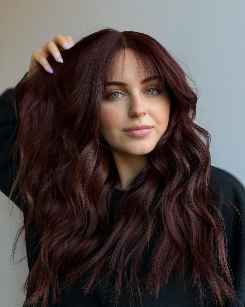 6. Deep Burgundy Curtain Bangs