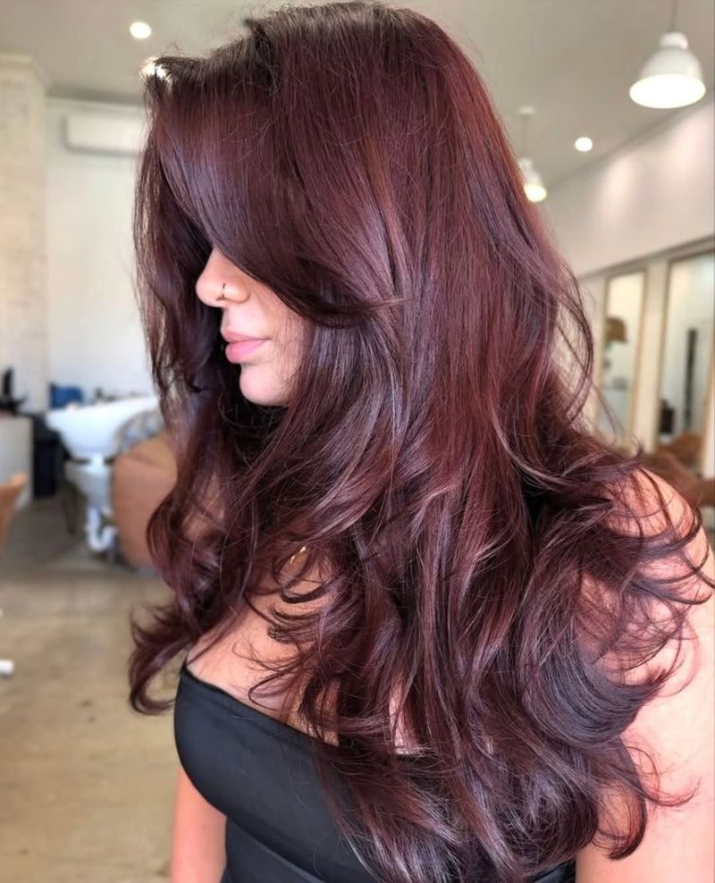 16. Deep Burgundy Layers with Side Bangs