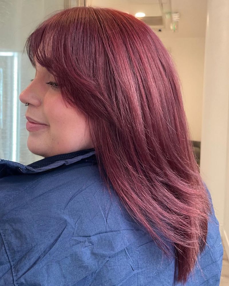 3. Deep Burgundy Layers with Soft Bangs