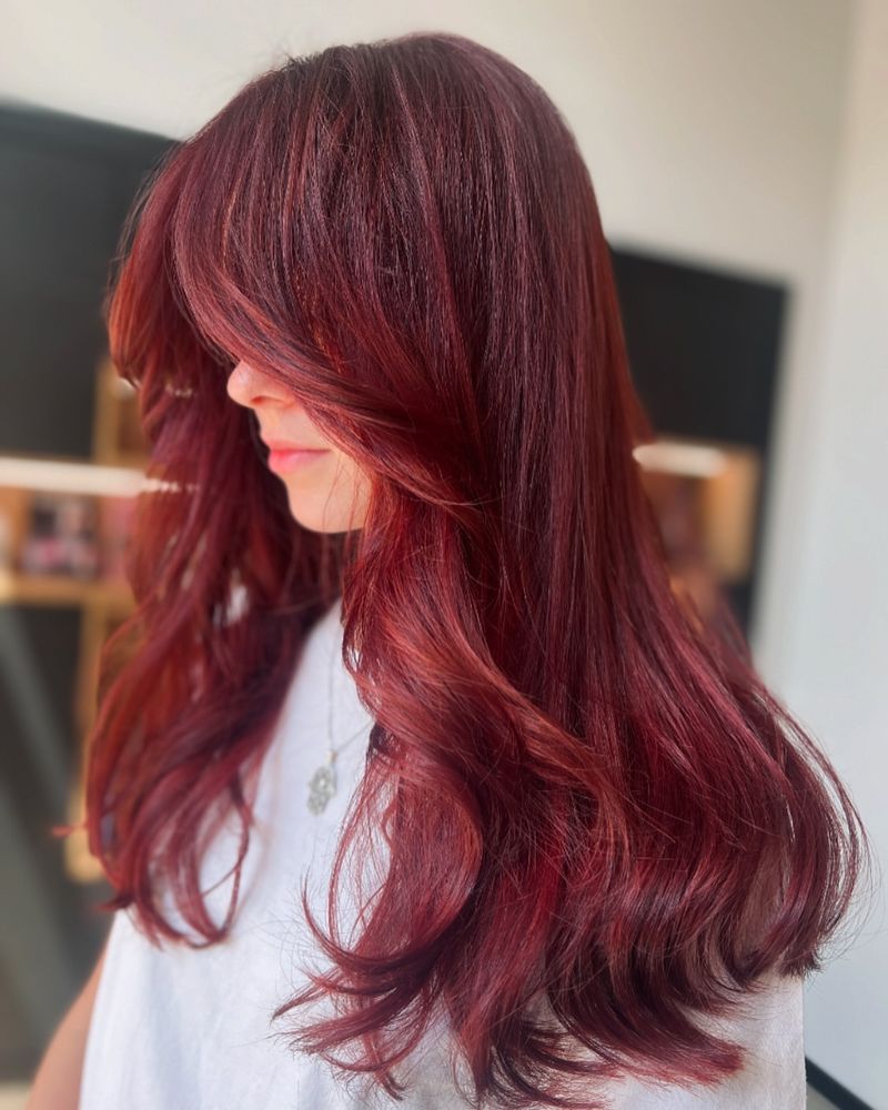 6. Deep Burgundy with Curtain Bangs