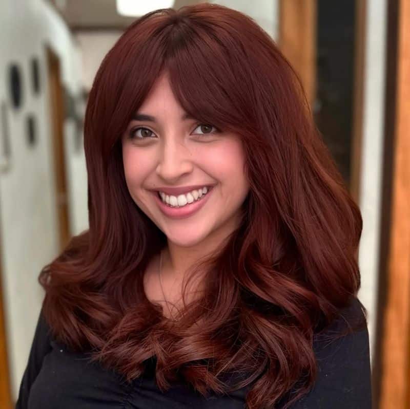 31. Deep Cinnamon Layers with Curtain Bangs
