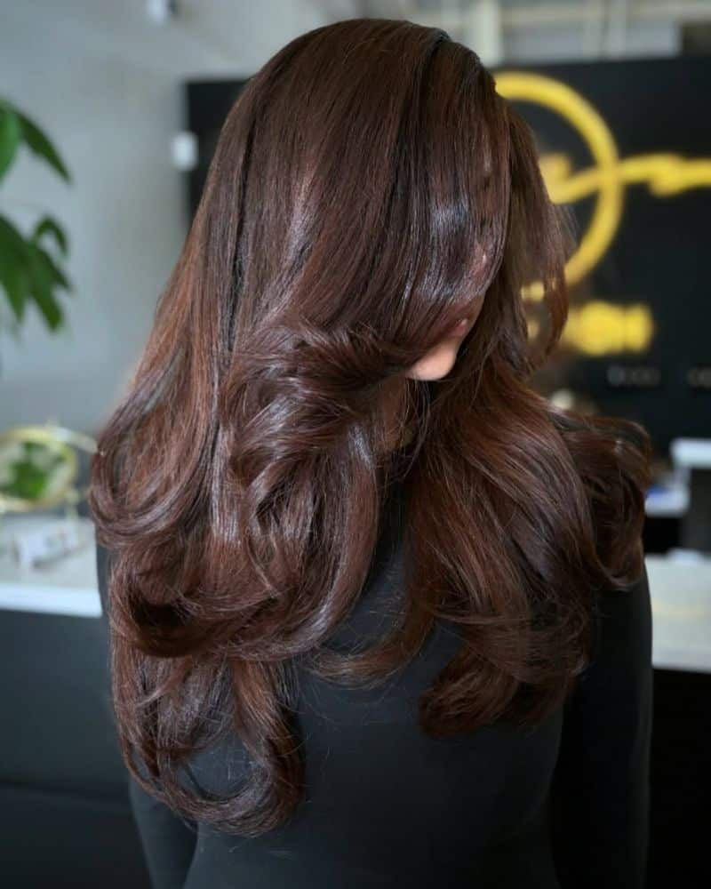 45. Deep Espresso Layers with Sweeping Side Bangs
