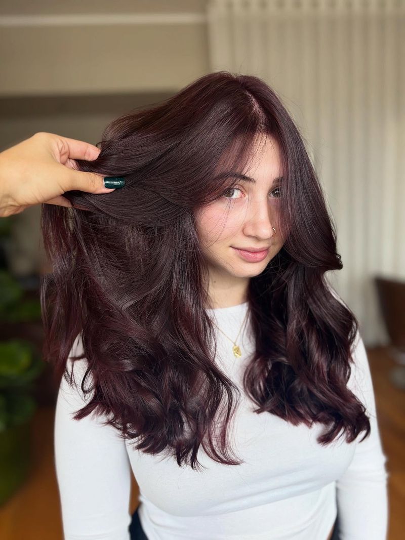 37. Deep Plum Blowout with Curtain Bangs