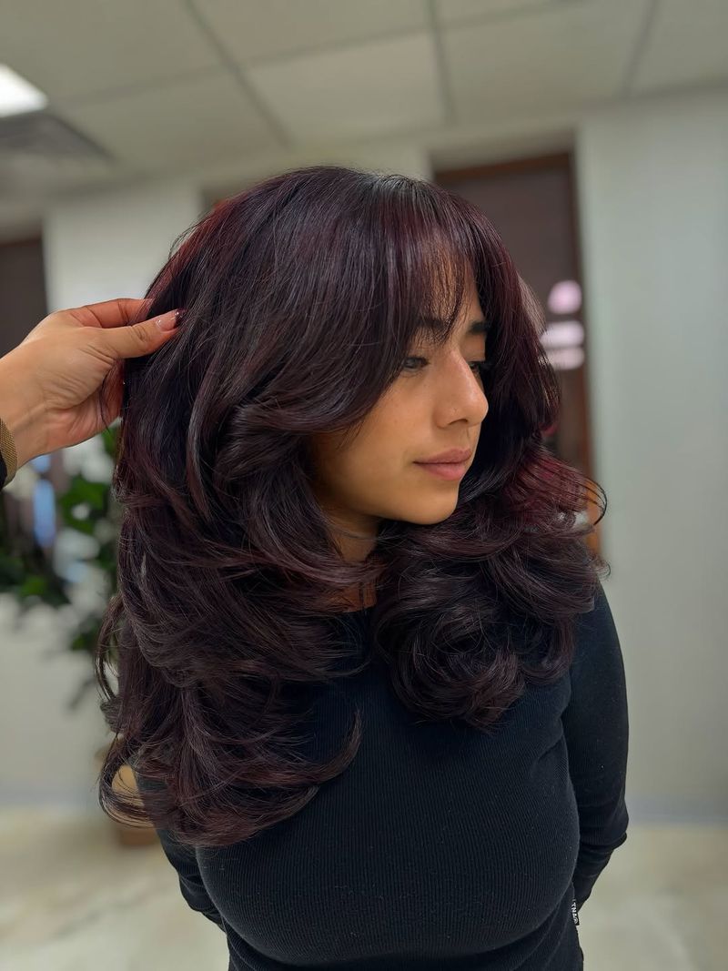 38. Deep Plum Blowout with Curtain Bangs