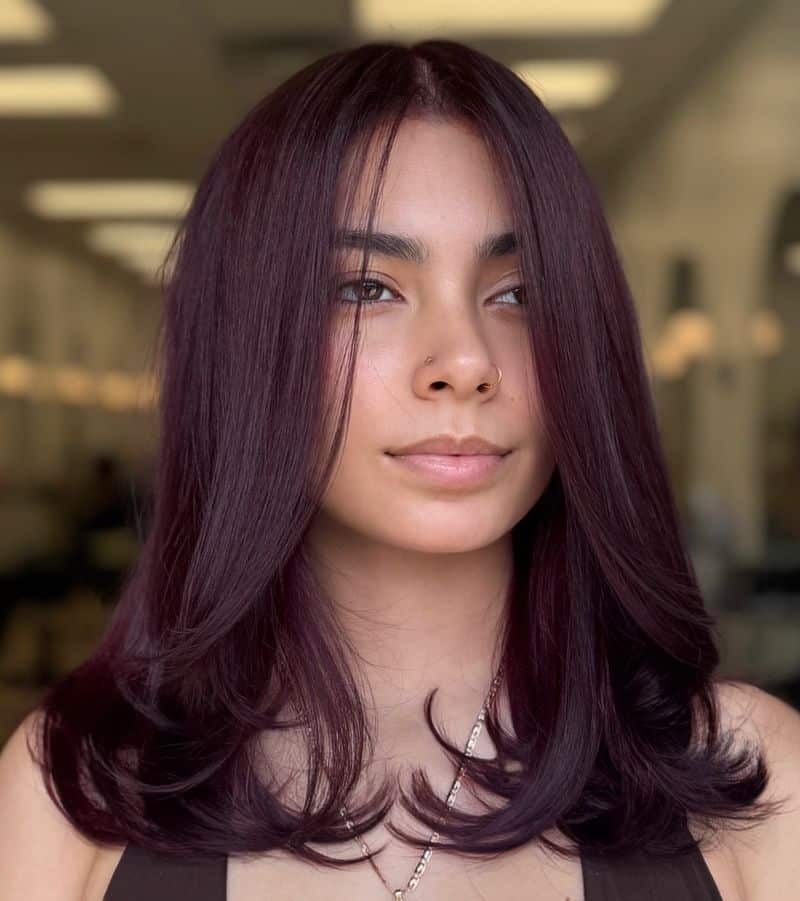 22. Deep Plum Blowout with Curtain Bangs