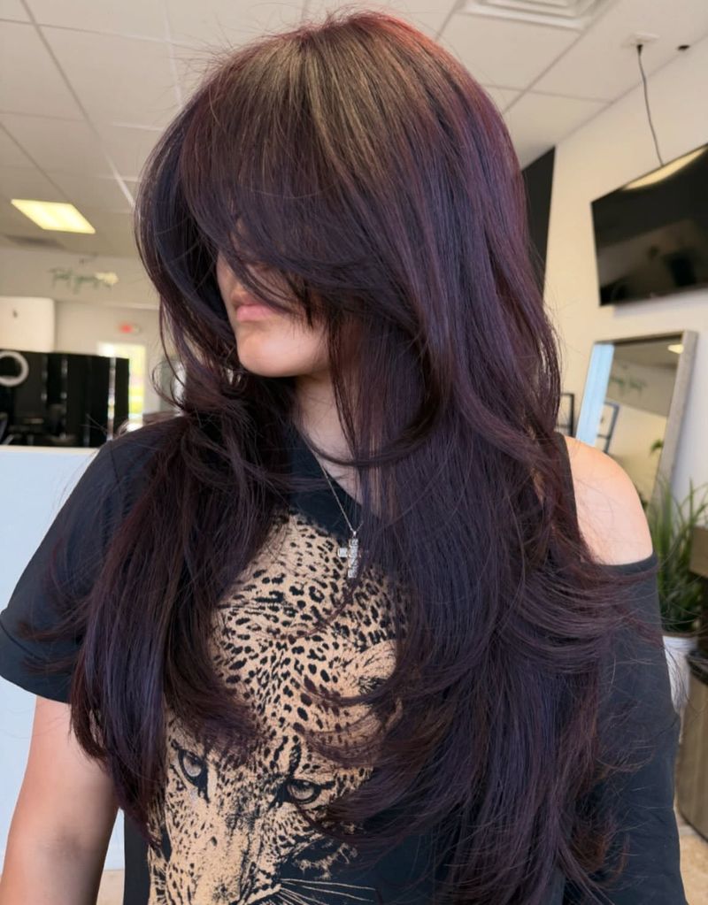 39. Deep Plum Feathered Layers with Curtain Bangs
