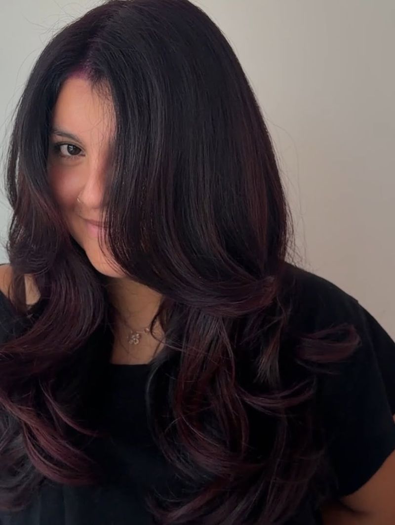 35. Deep Plum Layers with Side Swept Bangs