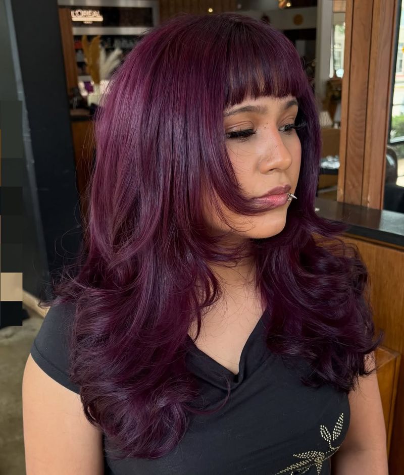 33. Deep Plum Layers with Soft Bangs