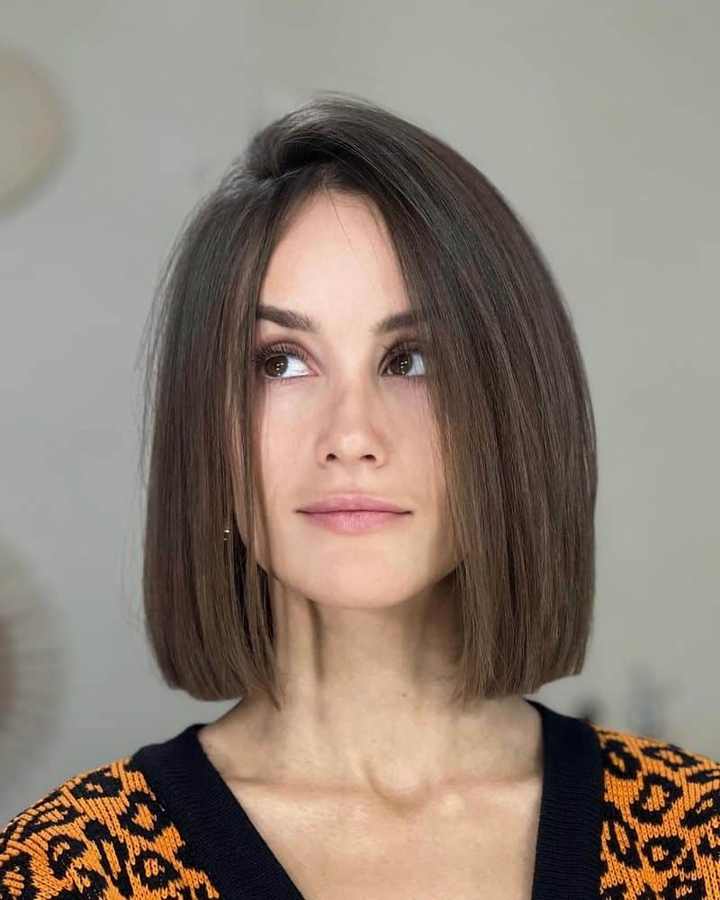 56. Deep Side Part Blunt Bob