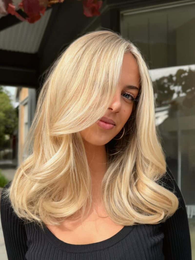 49. Deep Side Part with Creamy Waves