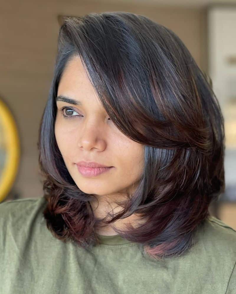 25. Deep Side Parted Lob with Feathered Layers