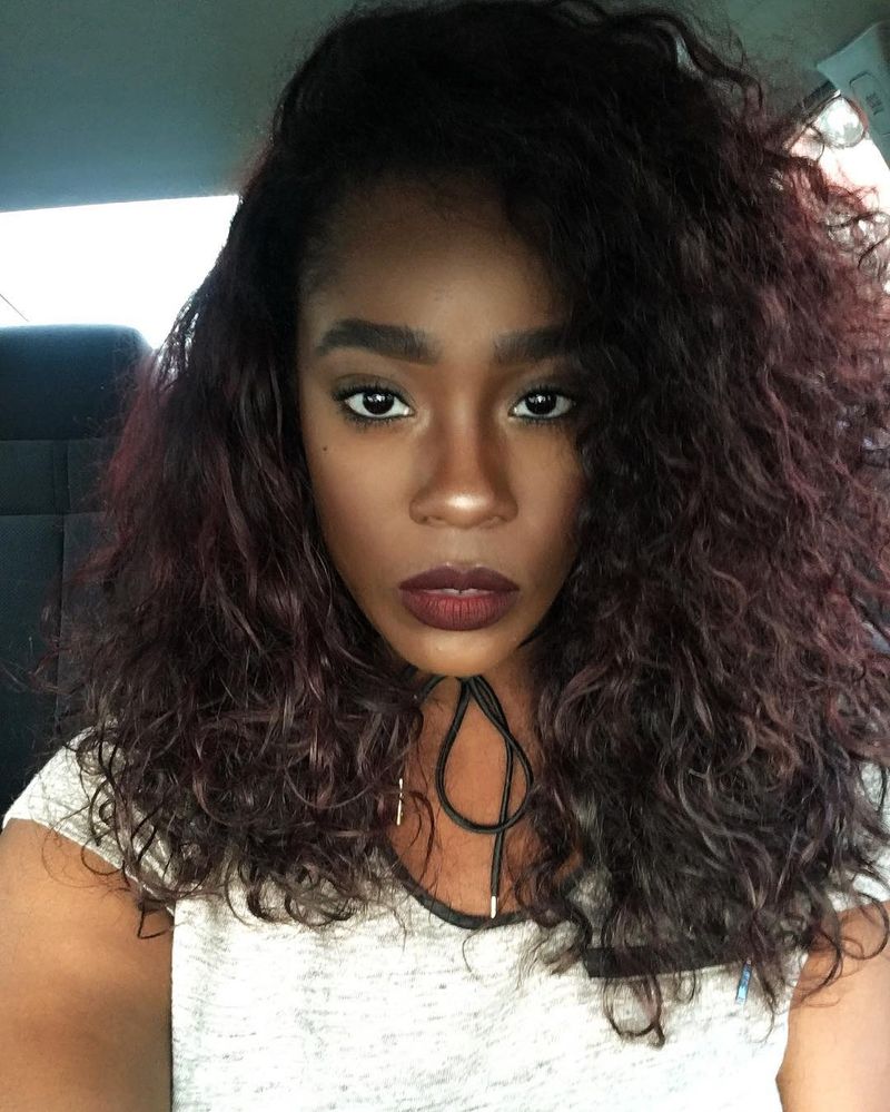27. Deep Wine Curls with a Side Part