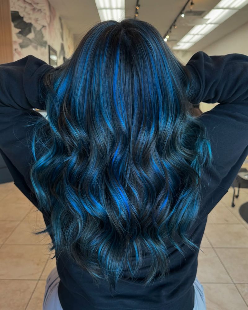 17. Electric Blue Highlights on Dark Hair