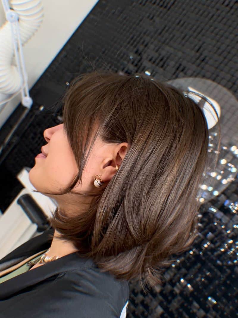 31. Feathered Brown Bob with Side Swept Bangs