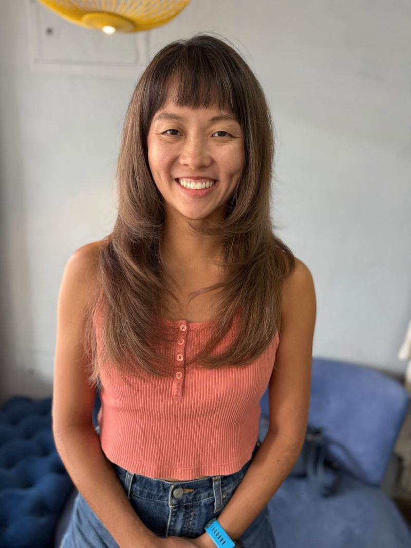 5. Feathered Layers with Baby Bangs