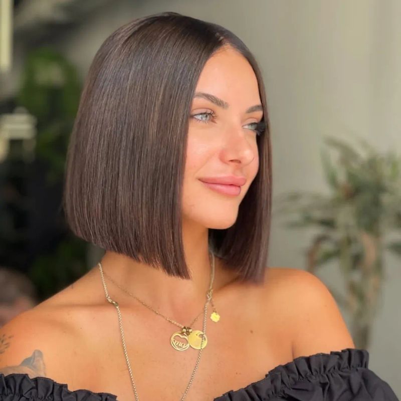 61. Glossy Center-Parted Chestnut Bob