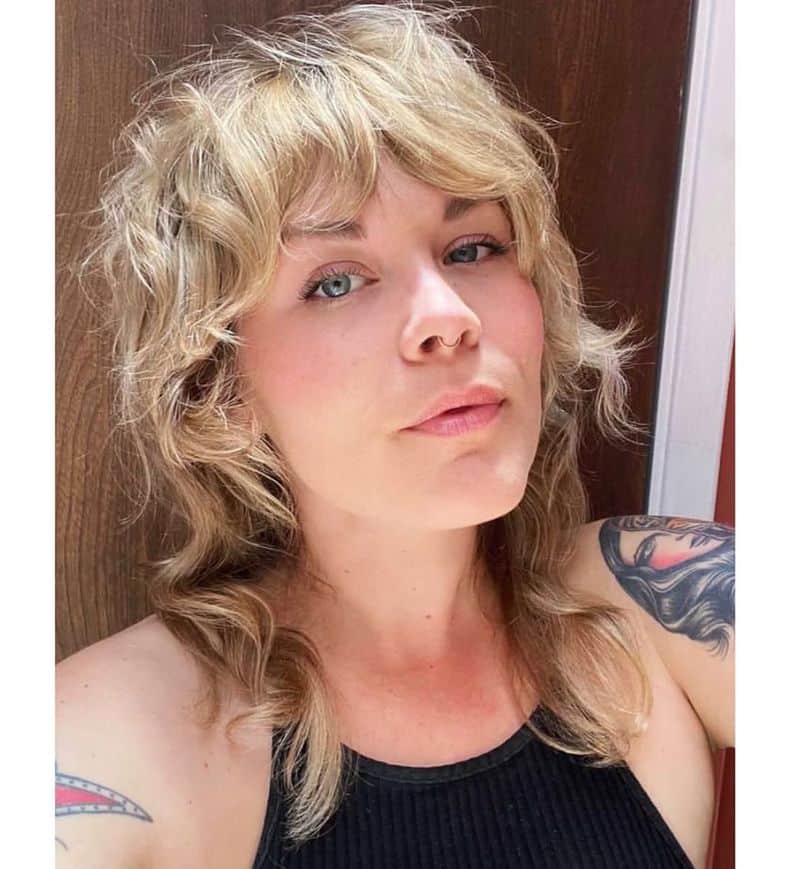 41. Golden Blonde Shag with Sweeping Fringe