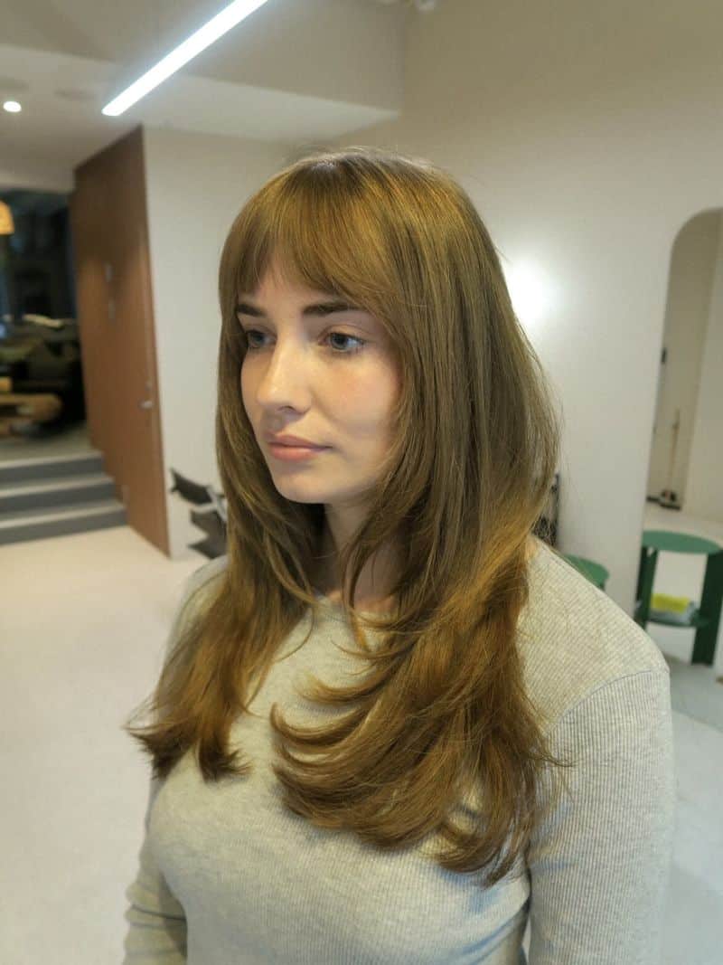 20. Golden Caramel Long Layers with Soft Fringe