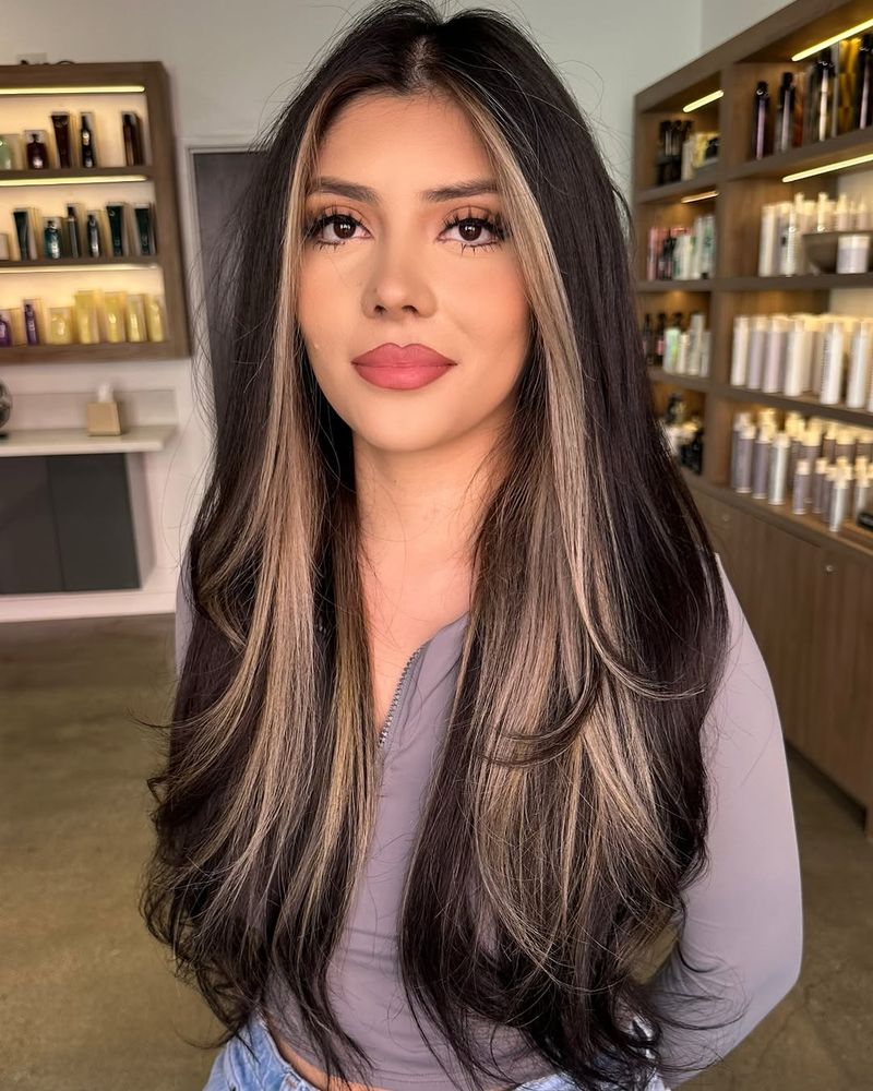22. High-Contrast Dark Brunette with Warm Champagne Framing