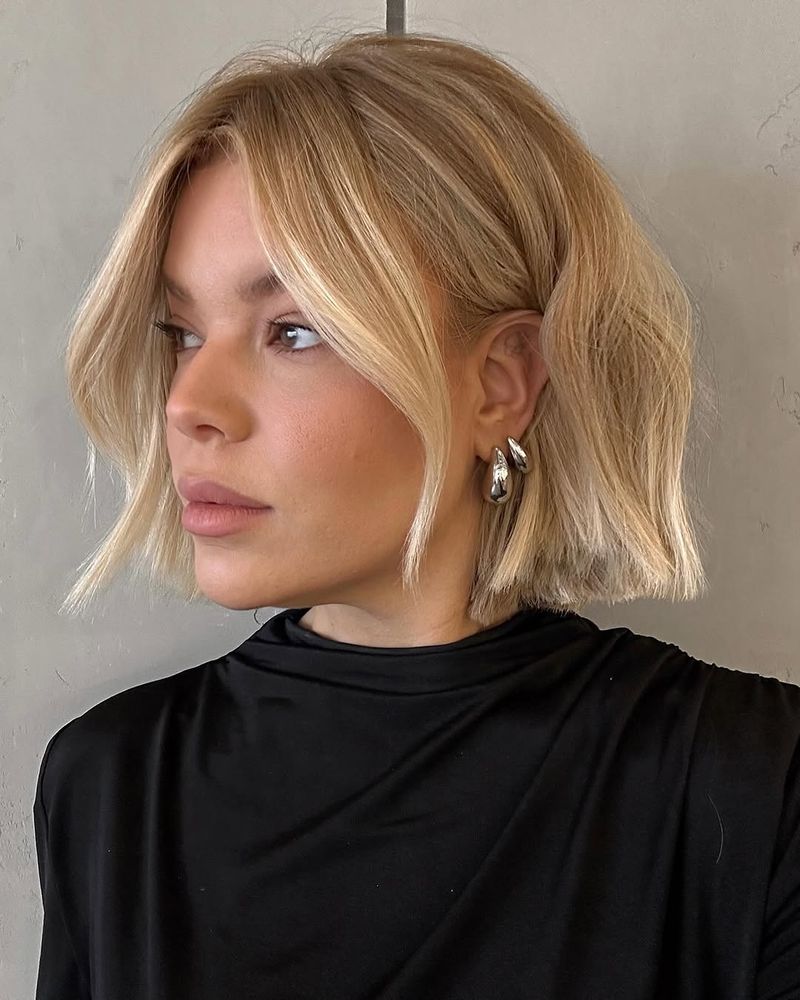 48. Honey Blonde Blunt Bob with Curtain Bangs