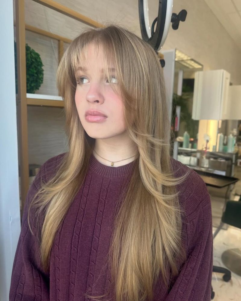 3. Honey Blonde Butterfly Layers with Feathered Fringe
