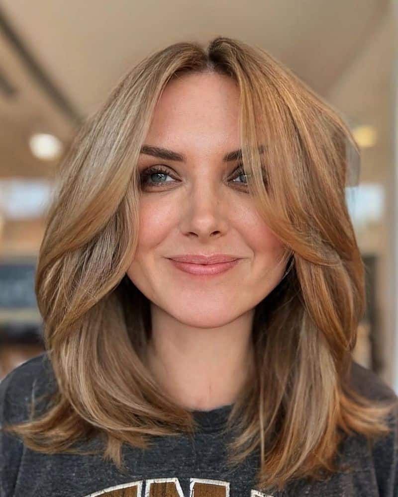 56. Honey Blonde Curtain Bang Lob