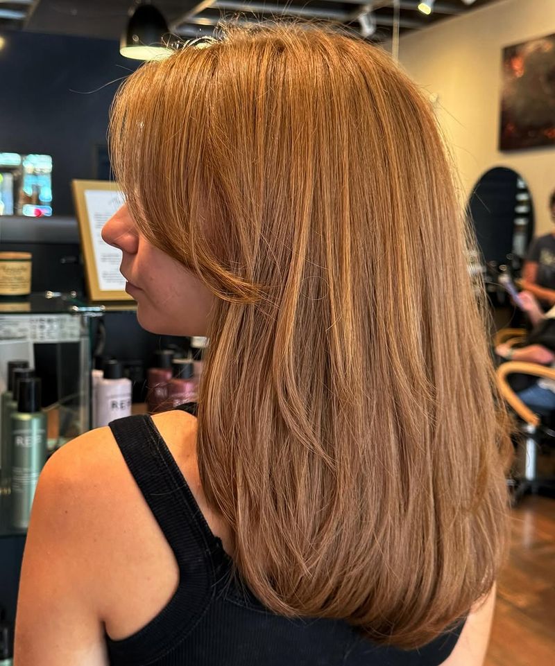22. Honey Blonde Layered Lob with Fringe