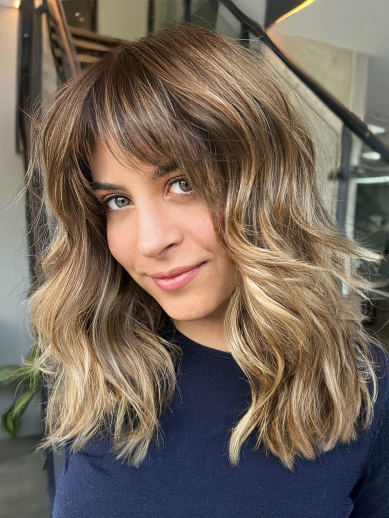 24. Honey Blonde Layered Shag with Curtain Bangs