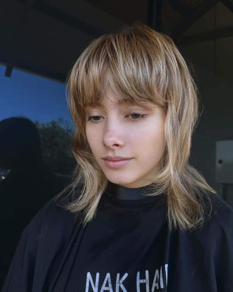 8. Honey Blonde Shag with Heavy Fringe
