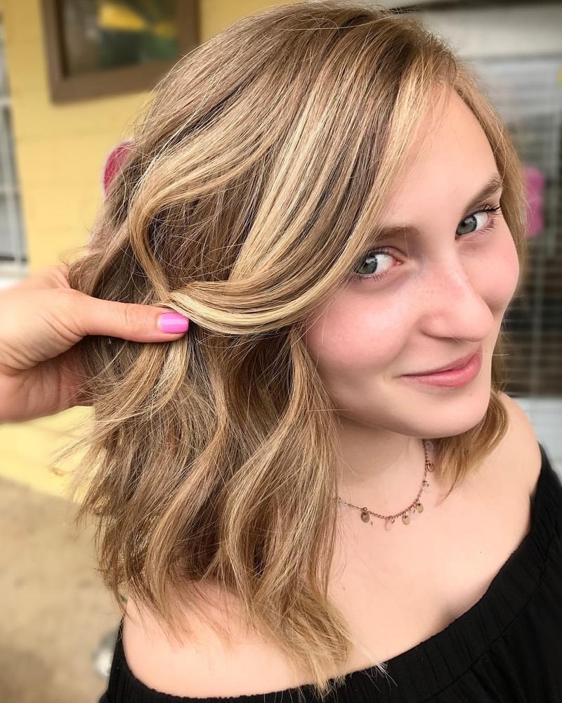 47. Honey Blonde Side-Swept Lob